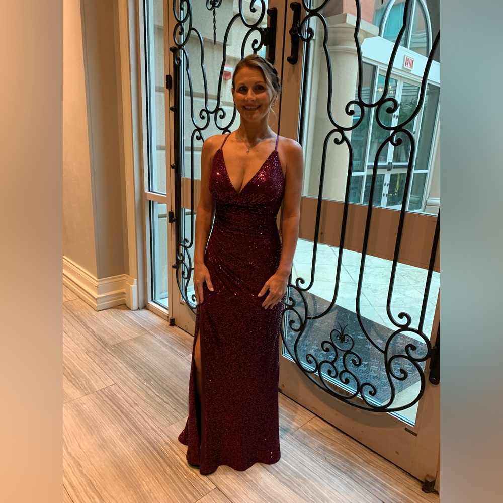 Maroon formal gown. Only worn once and in Perfect condition.